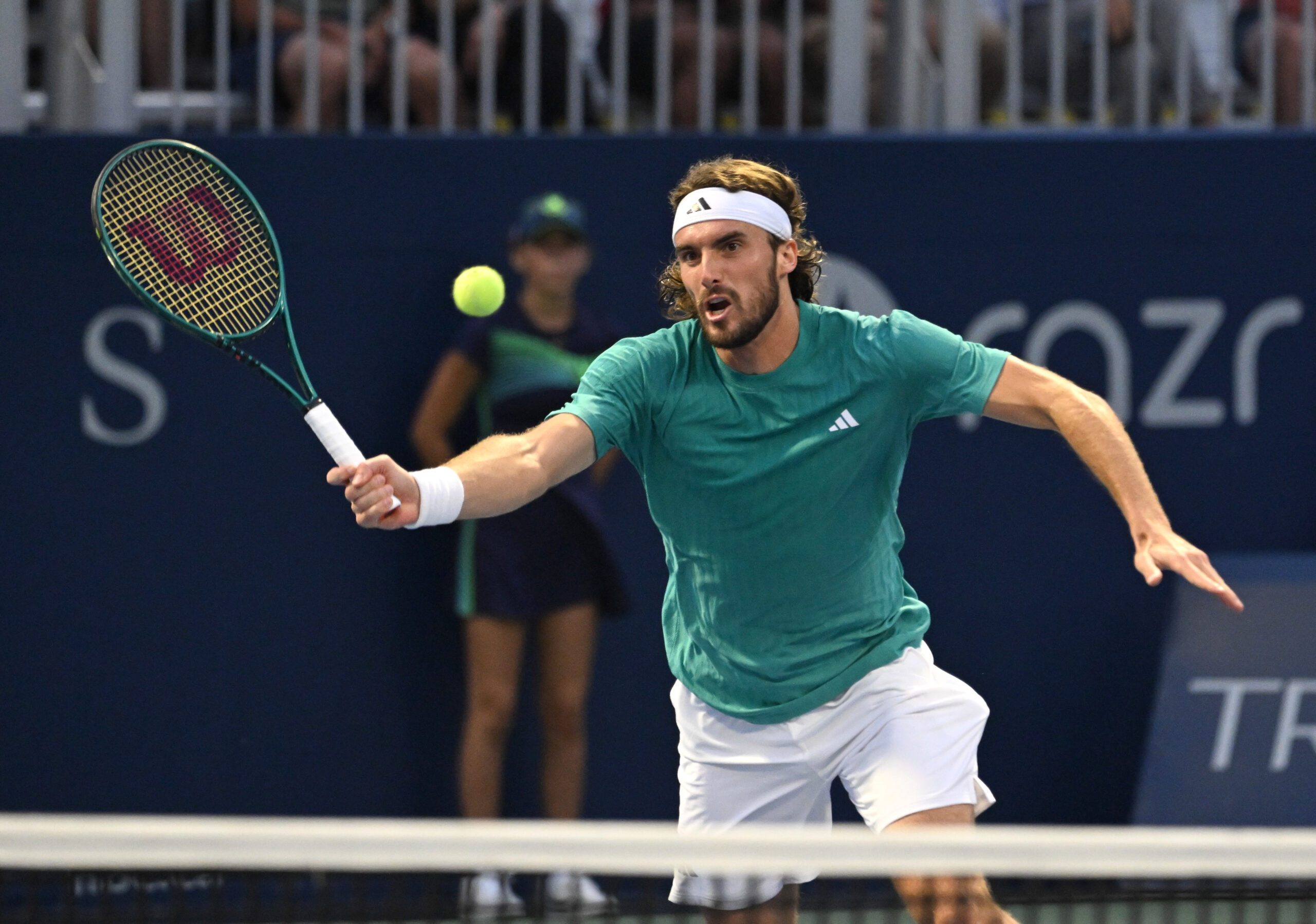 Jul 30, 2025; Toronto, ON, Canada;  Stefanos Tsitsipas (GRE) plays a shot against Christopher O'Connell (AUS) during second round play at Sobeys Stadium. Mandatory Credit: Dan Hamilton-Imagn Images