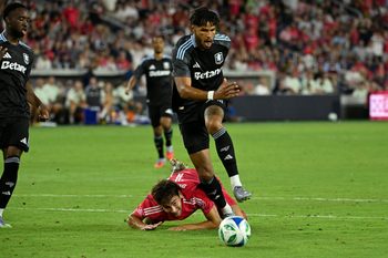 Jul 30, 2025; St. Louis, Missouri, USA; St. Louis City forward Simon Becher (11) falls to the pitch while battling Aston Villa defender Tyrone Mings (5) for the ball in the second half at Energizer Park. Mandatory Credit: Joe Puetz-Imagn Images