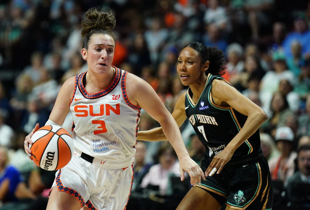Aug 3, 2025; Uncasville, Connecticut, USA; Connecticut Sun guard Marina Mabrey (3) drives the ball against New York Liberty guard Rebekah Gardner (7) in the first half at Mohegan Sun Arena. Mandatory Credit: David Butler II-Imagn Images