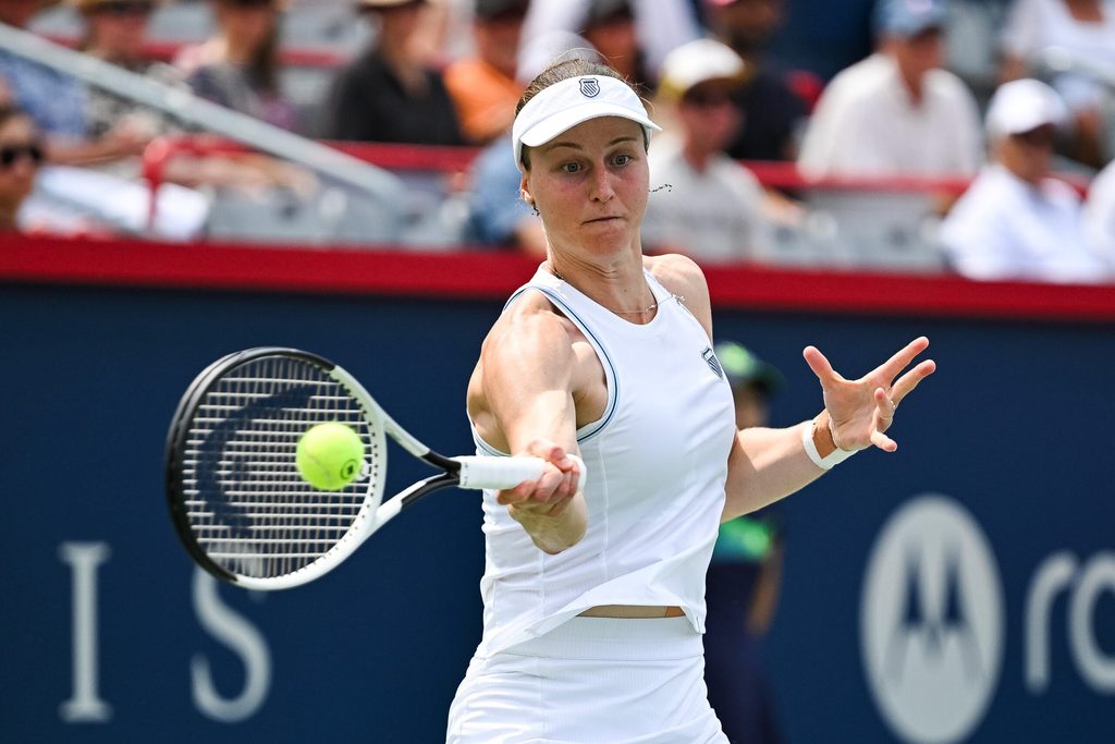 Jul 30, 2025; Montreal, QC, Canada; Liudmila Samsonova returns the ball to Naomi Osaka (JPN) in second round play at IGA Stadium. Mandatory Credit: David Kirouac-Imagn Images