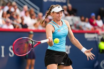 Aug 4, 2025; Montreal, QC, Canada; Elena Rybakina (KAZ) returns the ball to Marta Kostyuk (UKR) in quarterfinal play at IGA Stadium. Mandatory Credit: David Kirouac-Imagn Images