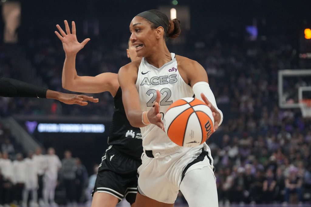 Aug 6, 2025; San Francisco, California, USA; Las Vegas Aces center A'ja Wilson (22) holds onto the ball against the Golden State Valkyries in the first quarter at the Chase Center. Mandatory Credit: Cary Edmondson-Imagn Images