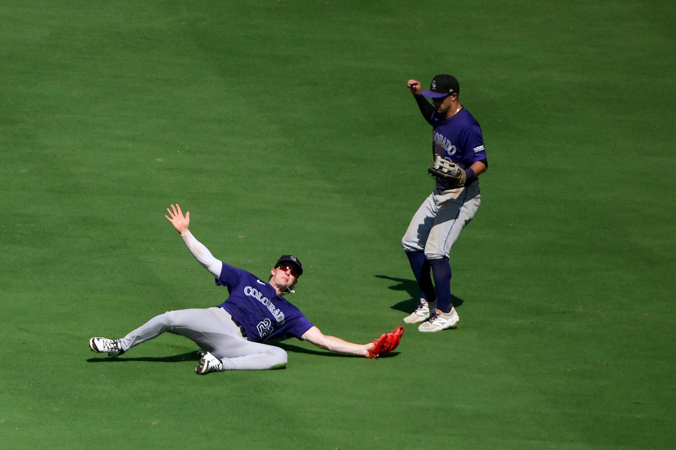 Aug 13, 2025; St. Louis, Missouri, USA;  Colorado Rockies center fielder Mickey Moniak (22) dives and catches a line drive hit by St. Louis Cardinals catcher Pedro Pages (not pictured) during the ninth inning at Busch Stadium. Mandatory Credit: Jeff Curry-Imagn Images
