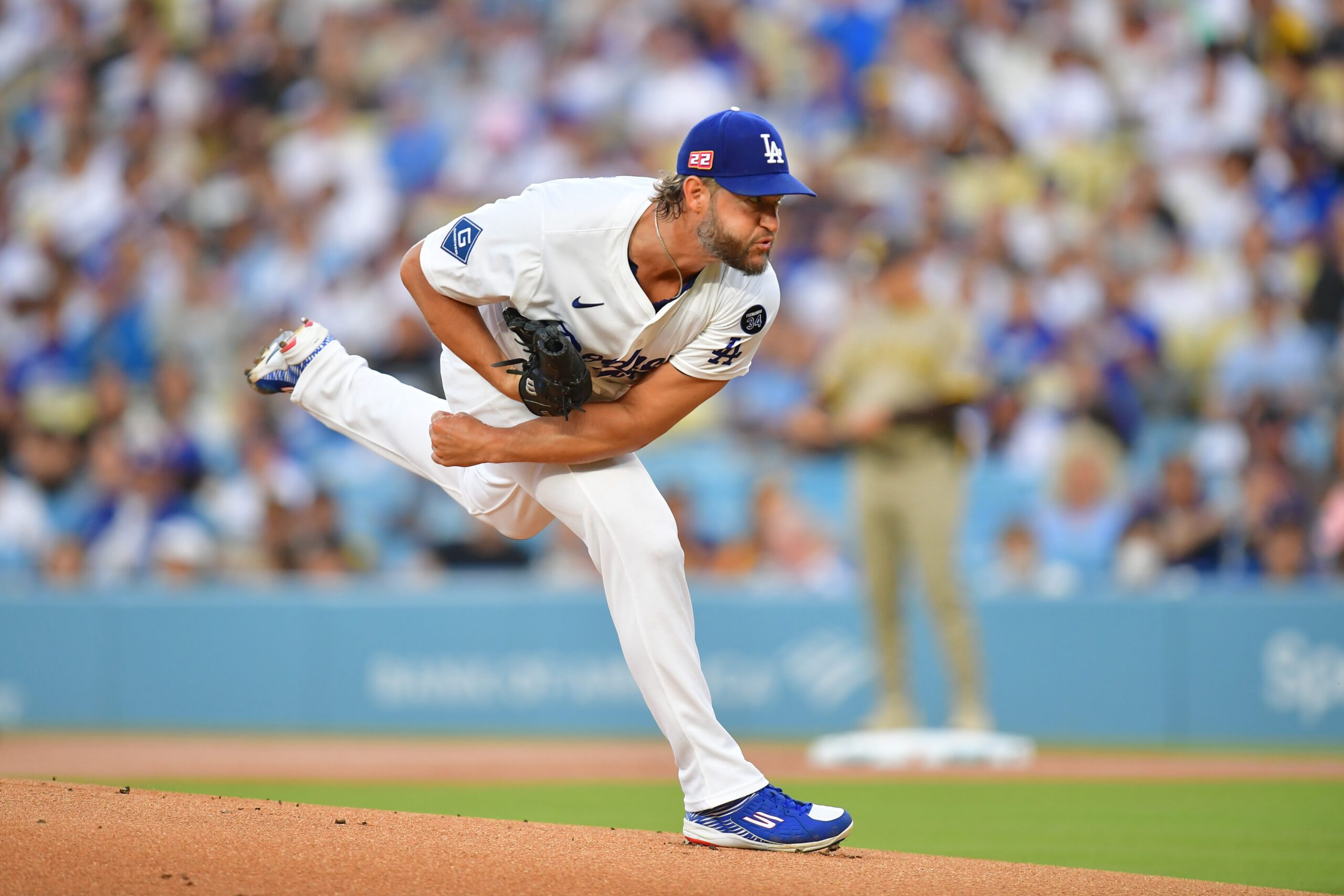 Aug 15, 2025; Los Angeles, California, USA;  Los Angeles Dodgers pitcher Clayton Kershaw (22) throws against the San Diego Padres during the first inning at Dodger Stadium. Mandatory Credit: Gary A. Vasquez-Imagn Images