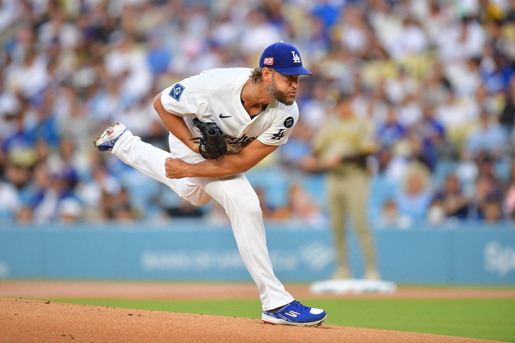 Aug 15, 2025; Los Angeles, California, USA; Los Angeles Dodgers pitcher Clayton Kershaw (22) throws against the San Diego Padres during the first inning at Dodger Stadium. Mandatory Credit: Gary A. Vasquez-Imagn Images