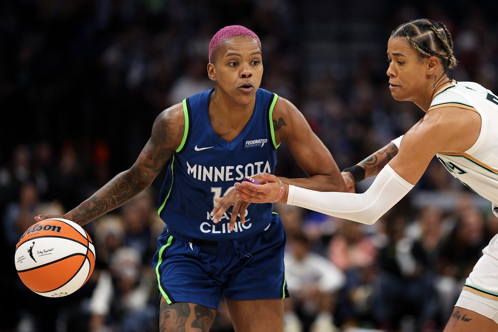 Aug 16, 2025; Minneapolis, Minnesota, USA; Minnesota Lynx guard Courtney Williams (10) works around New York Liberty guard Natasha Cloud (9) during the third quarter at Target Center. Mandatory Credit: Matt Krohn-Imagn Images