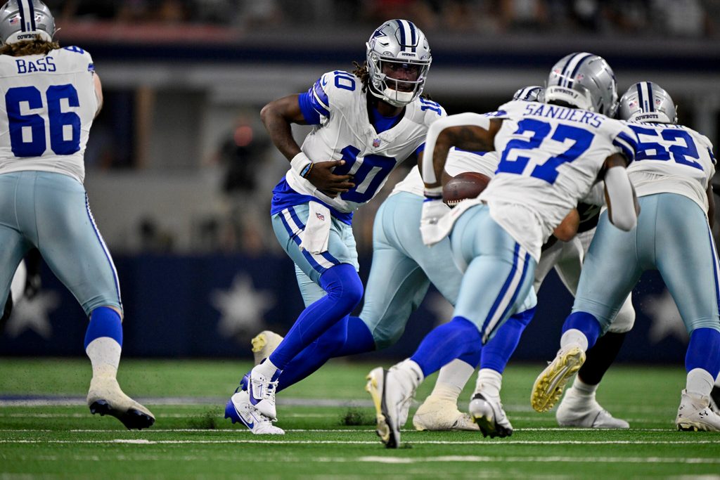 Aug 16, 2025; Arlington, Texas, USA; Dallas Cowboys quarterback Joe Milton III (10) hands off the ball to running back Miles Sanders (27) during the game between the Dallas Cowboys and the Baltimore Ravens at AT&T Stadium. Mandatory Credit: Jerome Miron-Imagn Images