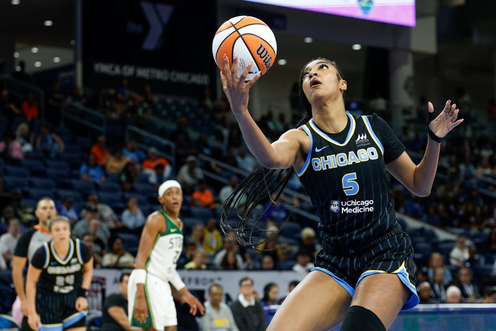 Aug 19, 2025; Chicago, Illinois, USA; Chicago Sky forward Angel Reese (5) drives to the basket against the Seattle Storm during the first half at Wintrust Arena. Mandatory Credit: Kamil Krzaczynski-Imagn Images