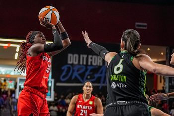 Aug 21, 2025; College Park, Georgia, USA; Atlanta Dream guard Rhyne Howard (10) shoots over Minnesota Lynx forward Bridget Carleton (6) during the first half at Gateway Center Arena at College Park. Mandatory Credit: Dale Zanine-Imagn Images