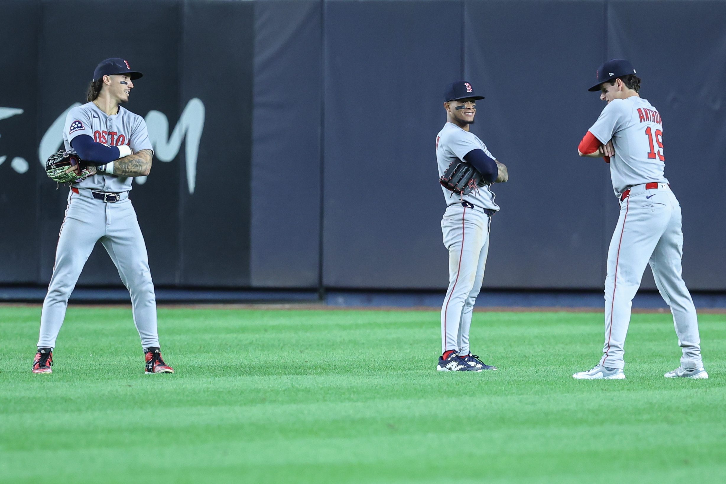 Aug 21, 2025; Bronx, New York, USA;  Boston Red Sox left fielder Jarren Duran (16), center fielder Ceddanne Rafaela (3) and right fielder Roman Anthony (19) pose after defeating the New York Yankees 6-3 at Yankee Stadium. Mandatory Credit: Wendell Cruz-Imagn Images