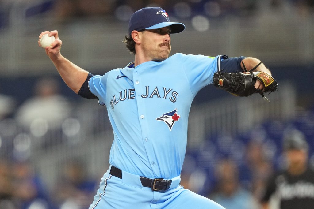 Aug 22, 2025; Miami, Florida, USA; Toronto Blue Jays starting pitcher Shane Bieber (57) throws a pitch against the Miami Marlins at loanDepot Park. Mandatory Credit: Jim Rassol-Imagn Images