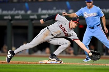 Aug 24, 2025; Arlington, Texas, USA; Cleveland Guardians first baseman Kyle Manzardo (9) fields a throw to first base during the sixth inning against the Texas Rangers at Globe Life Field. Mandatory Credit: Jerome Miron-Imagn Images