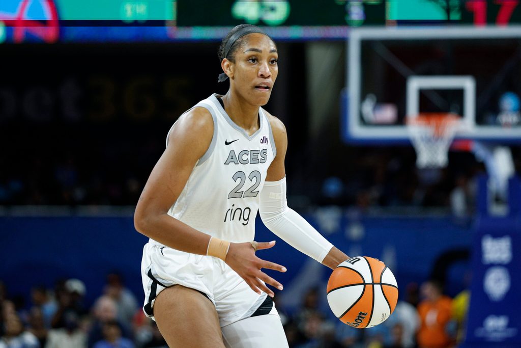 Aug 25, 2025; Chicago, Illinois, USA; Las Vegas Aces center A'ja Wilson (22) brings the ball up court during the second half of a WNBA game against the Chicago Sky at Wintrust Arena. Mandatory Credit: Kamil Krzaczynski-Imagn Images