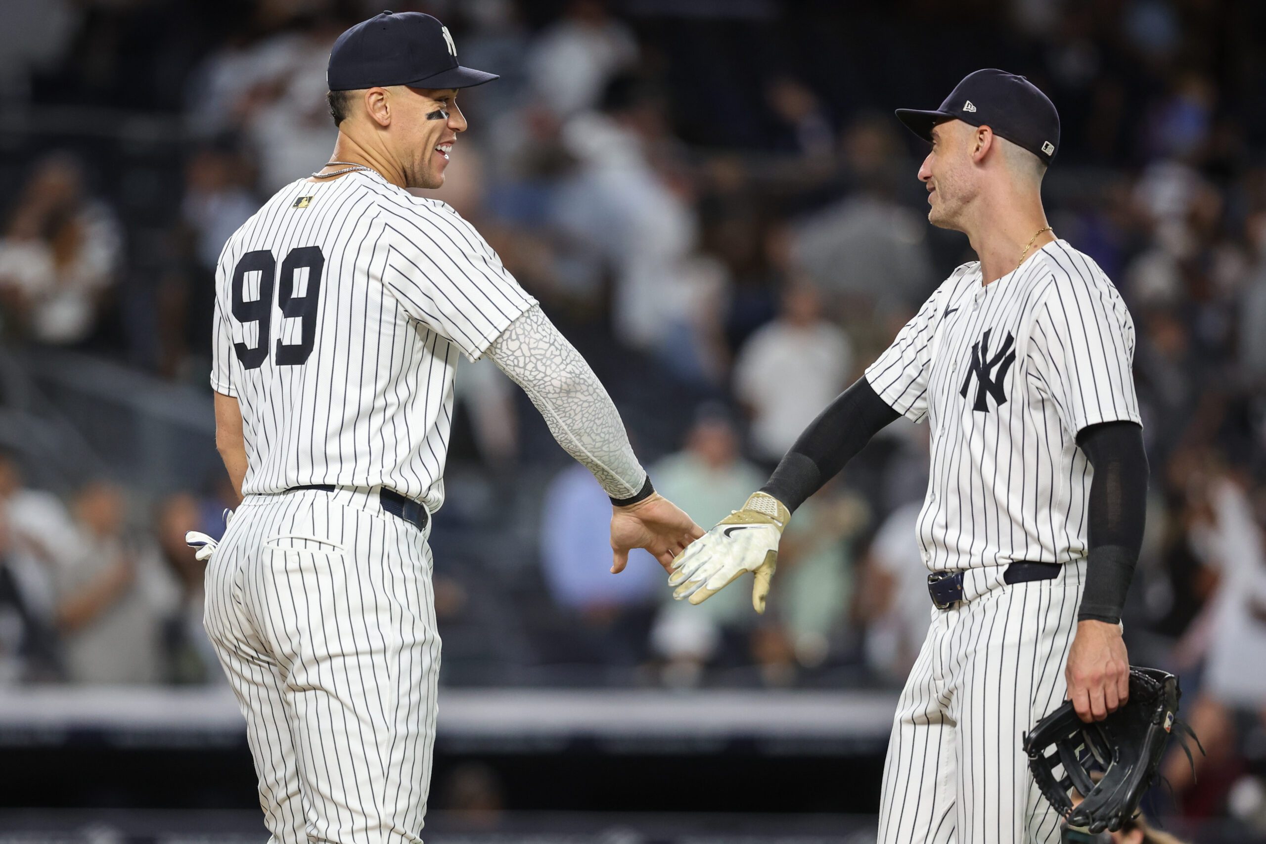 Aug 26, 2025; Bronx, New York, USA; New York Yankees designated hitter Aaron Judge (99) and left fielder Cody Bellinger (35) celebrate after defeating the Washington Nationals 5-1 at Yankee Stadium. Mandatory Credit: Wendell Cruz-Imagn Images