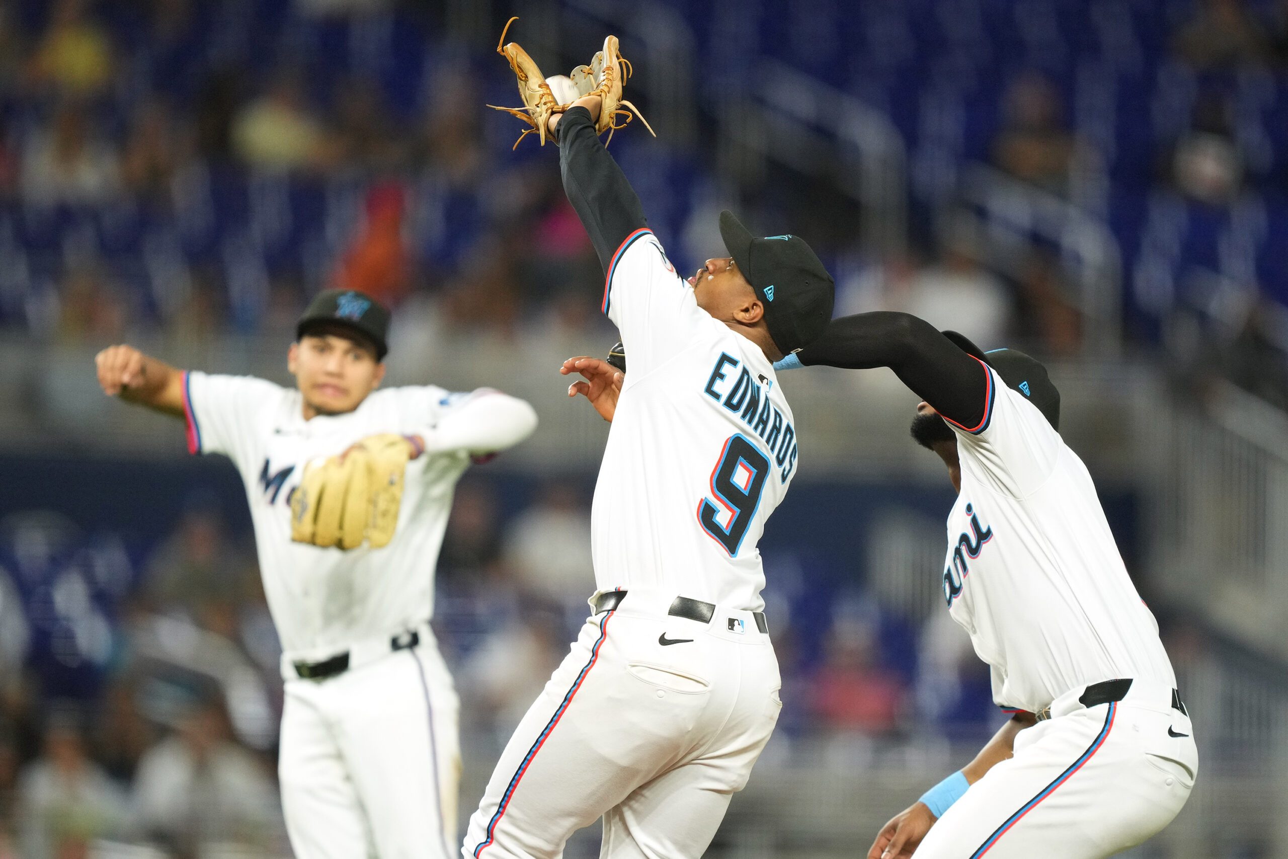 Aug 26, 2025; Miami, Florida, USA; Miami Marlins second baseman Xavier Edwards (9) catches a pop fly in the infield in the ninth inning against the Atlanta Braves at loanDepot Park. Mandatory Credit: Jim Rassol-Imagn Images