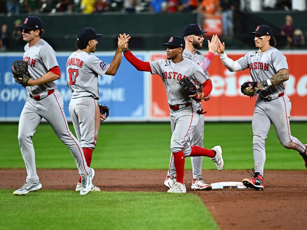 Aug 27, 2025; Baltimore, Maryland, USA; Boston Red Sox players celebrate the win against the Baltimore Orioles at Oriole Park at Camden Yards. Mandatory Credit: James A. Pittman-Imagn Images
