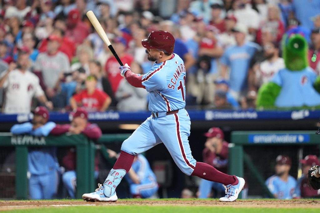 Aug 28, 2025; Philadelphia, Pennsylvania, USA; Philadelphia Phillies designated hitter Kyle Schwarber (12) hits a three-run home run against the Atlanta Braves in the seventh inning at Citizens Bank Park. Mandatory Credit: Kyle Ross-Imagn Images