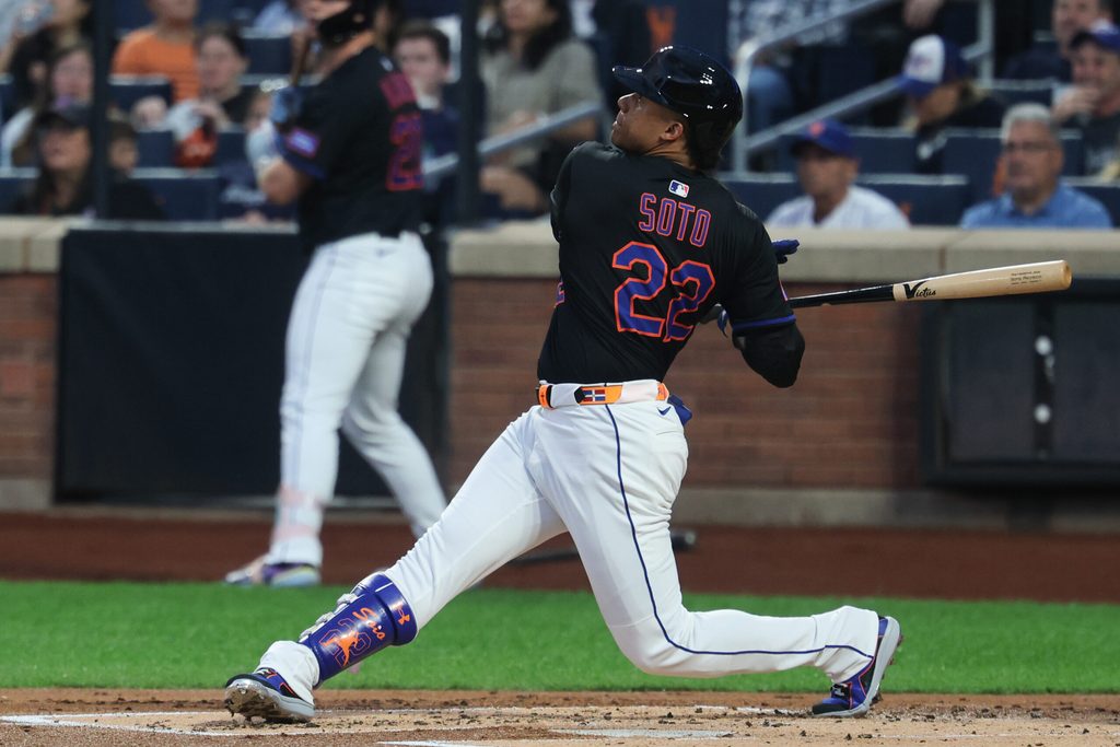 Aug 29, 2025; New York City, New York, USA; New York Mets right fielder Juan Soto (22) hits a two run home run during the first inning against the Miami Marlins at Citi Field. Mandatory Credit: Vincent Carchietta-Imagn Images