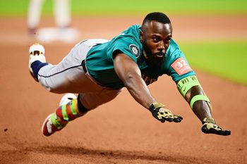 Aug 29, 2025; Cleveland, Ohio, USA; Seattle Mariners left fielder Randy Arozarena (56) tries to stretch a double into a triple against the Cleveland Guardians during the eighth inning at Progressive Field. Arozarena was out on the play. Mandatory Credit: Ken Blaze-Imagn Images