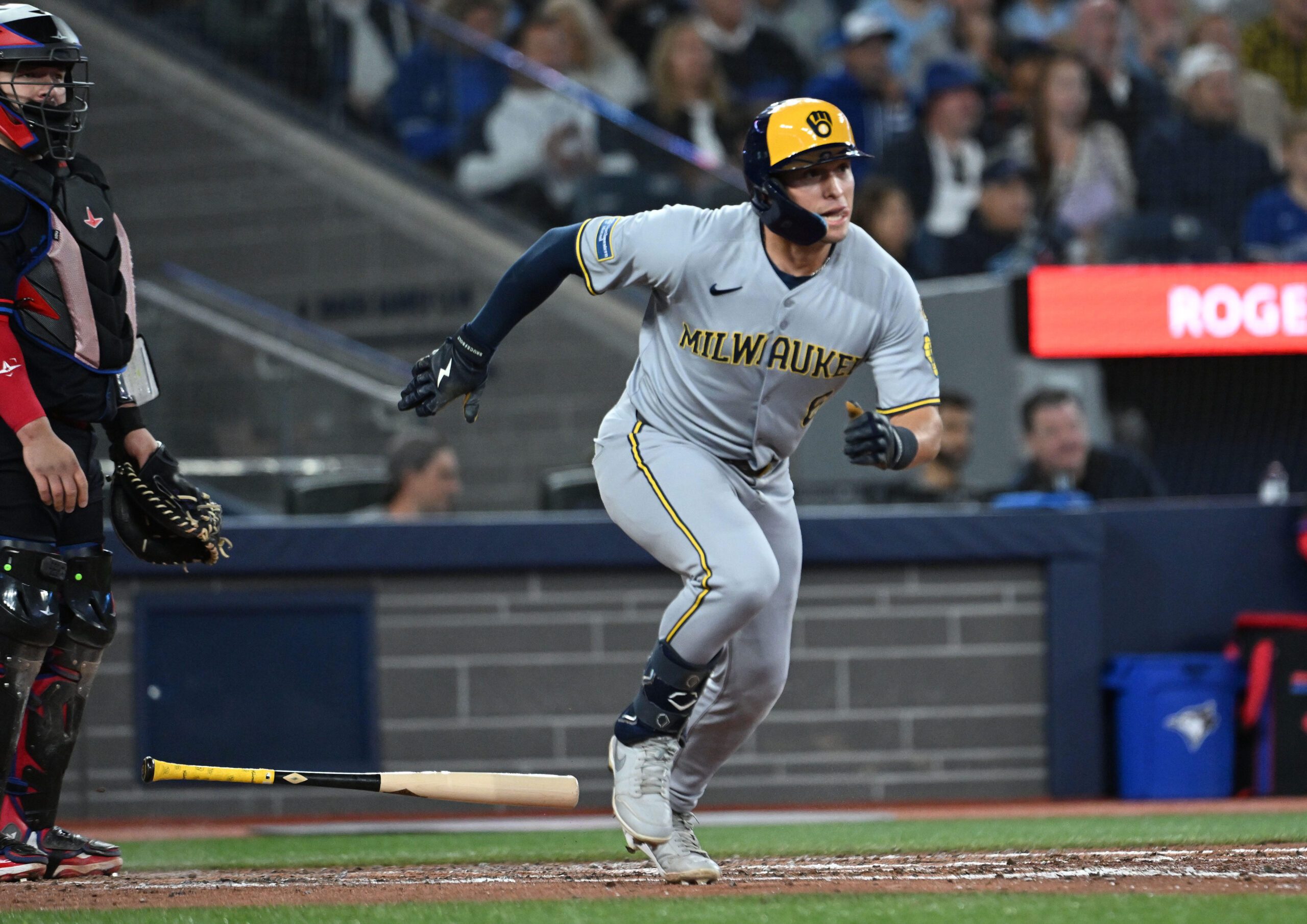 Aug 29, 2025; Toronto, Ontario, CAN; Milwaukee Brewers left fielder Isaac Collins (6) hits a single against the Toronto Blue Jays in the fifth inning at Rogers Centre. Mandatory Credit: Dan Hamilton-Imagn Images