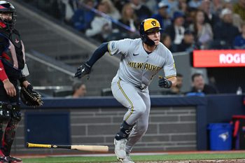 Aug 29, 2025; Toronto, Ontario, CAN; Milwaukee Brewers left fielder Isaac Collins (6) hits a single against the Toronto Blue Jays in the fifth inning at Rogers Centre. Mandatory Credit: Dan Hamilton-Imagn Images