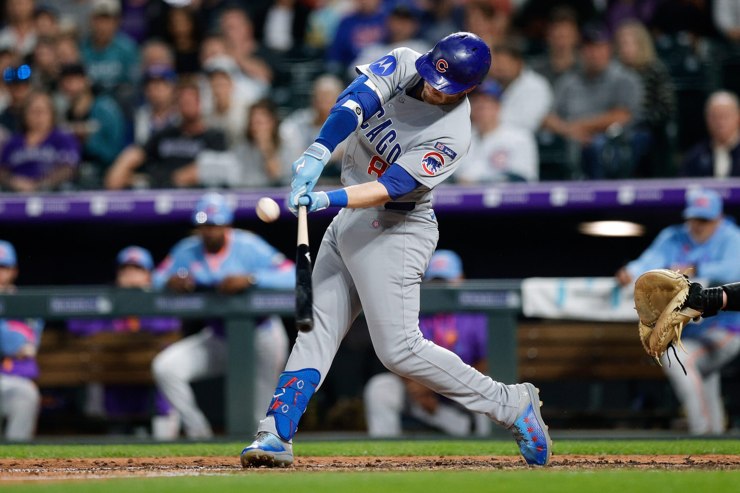 Aug 29, 2025; Denver, Colorado, USA; Chicago Cubs left fielder Ian Happ (8) hits an RBI ground rule double in the fifth inning against the Colorado Rockies at Coors Field. Mandatory Credit: Isaiah J. Downing-Imagn Images
