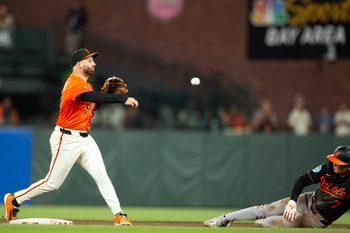 Aug 29, 2025; San Francisco, California, USA; San Francisco Giants second baseman Casey Schmitt (10) throws over Baltimore Orioles second baseman Jackson Holliday (7) too late to complete a double play during the ninth inning at Oracle Park. Mandatory Credit: D. Ross Cameron-Imagn Images
