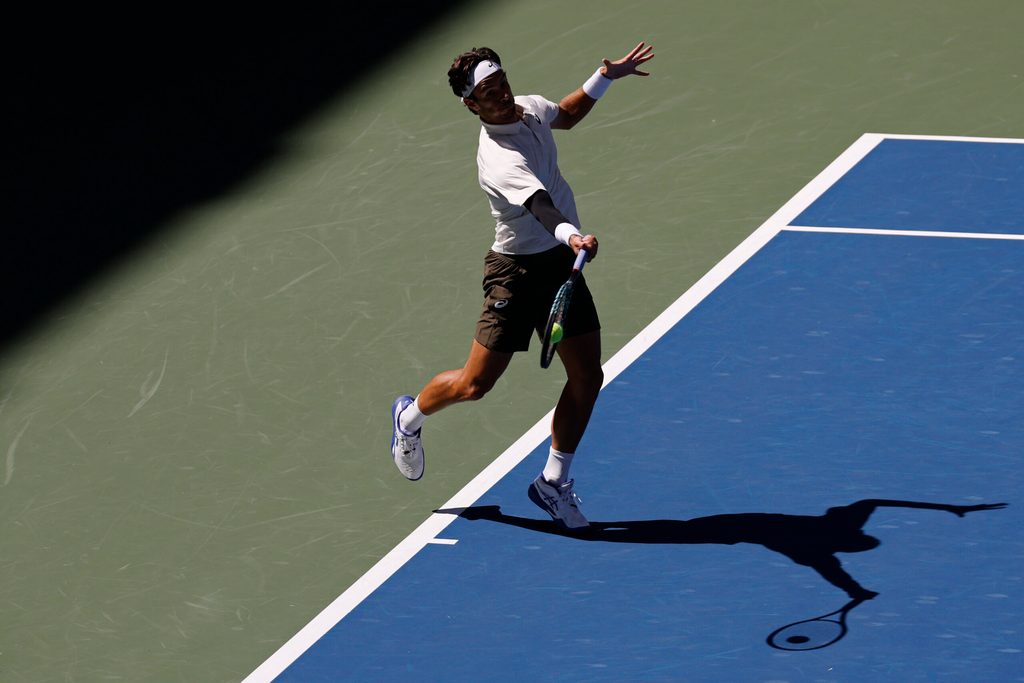 Aug 30, 2025; Flushing, NY, USA; Lorenzo Musetti (ITA) hits a forehand against Flavio Cobolli (ITA) (not pictured) on day seven of the 2025 US Open tennis championships at Billie Jean King National Tennis Center. Mandatory Credit: Geoff Burke-Imagn Images