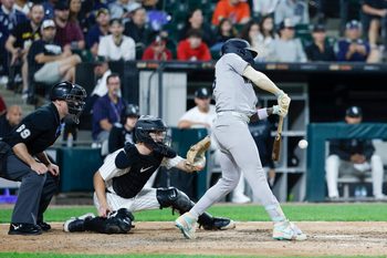 Aug 30, 2025; Chicago, Illinois, USA; New York Yankees second baseman Jazz Chisholm Jr. (13) hits one-run double against the Chicago White Sox during the 11th inning at Rate Field. Mandatory Credit: Kamil Krzaczynski-Imagn Images