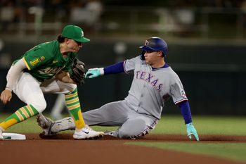 Aug 30, 2025; West Sacramento, California, USA; Texas Rangers designated hitter Joc Pederson (4) slides ahead of Athletics second baseman Zack Gelof’s tag (left) during the seventh inning at Sutter Health Park. Mandatory Credit: Dennis Lee-Imagn Images