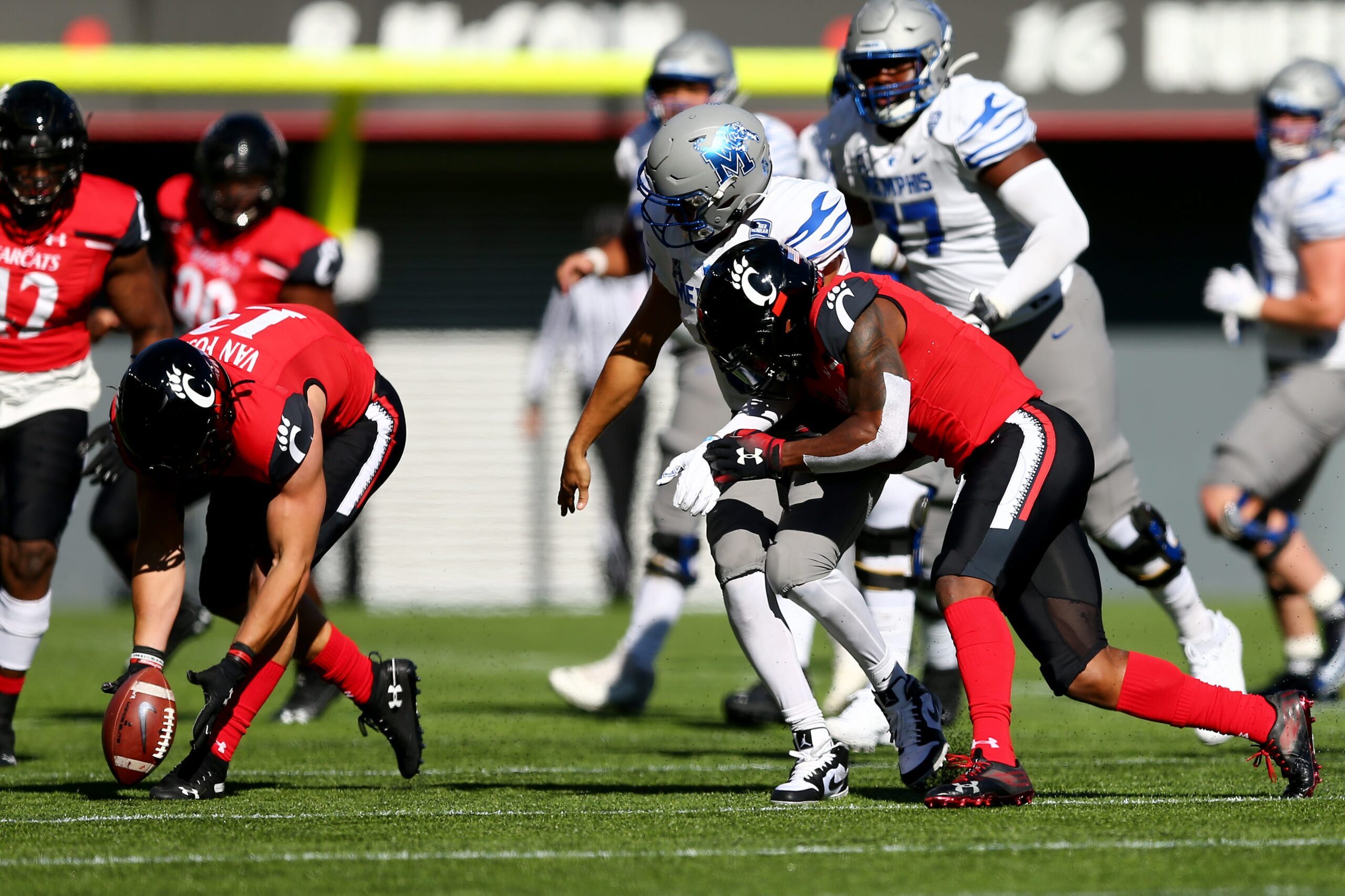 Cincinnati Bearcats linebacker Ty Van Fossen (13), left, collects a forced fumble during the fourth quarter of a college football game against the Memphis Tigers, Saturday, Oct. 31, 2020, at Nippert Stadium in Cincinnati. The Cincinnati Bearcats won 49-10.

Memphis Tigers At Cincinnati Bearcats Oct 31