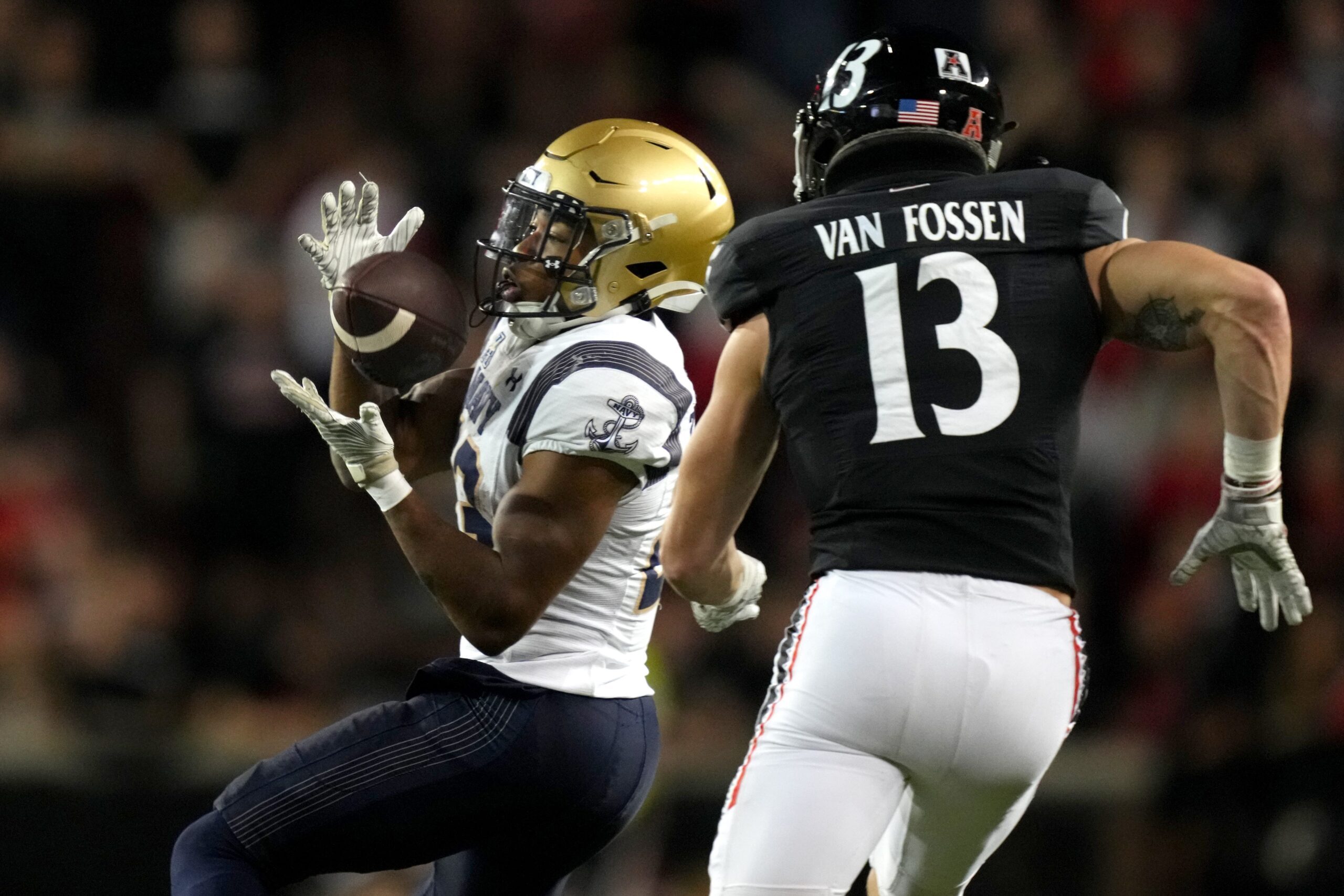 Navy Midshipmen wide receiver Vincent Terrell Jr. (23) catches a pass as Cincinnati Bearcats linebacker Ty Van Fossen (13) defends in the fourth quarter during a college football game, Saturday, Nov. 5, 2022, at Nippert Stadium in Cincinnati. The Cincinnati Bearcats won, 20-10.

Ncaaf Navy Midshipmen At Cincinnati Bearcats Nov 6 0706