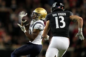 Navy Midshipmen wide receiver Vincent Terrell Jr. (23) catches a pass as Cincinnati Bearcats linebacker Ty Van Fossen (13) defends in the fourth quarter during a college football game, Saturday, Nov. 5, 2022, at Nippert Stadium in Cincinnati. The Cincinnati Bearcats won, 20-10.

Ncaaf Navy Midshipmen At Cincinnati Bearcats Nov 6 0706