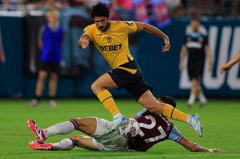 West Ham United defender Nayef Aguerd (27) trips up Wolverhampton Wanderers forward Goncalo Guedes (29) during the second half of The Stateside Cup soccer tournament game Saturday, July 27, 2024 at EverBank Stadium in Jacksonville, Fla. The Wolverhampton Wanderers defeated West Ham United 3-1 in exhibition play.