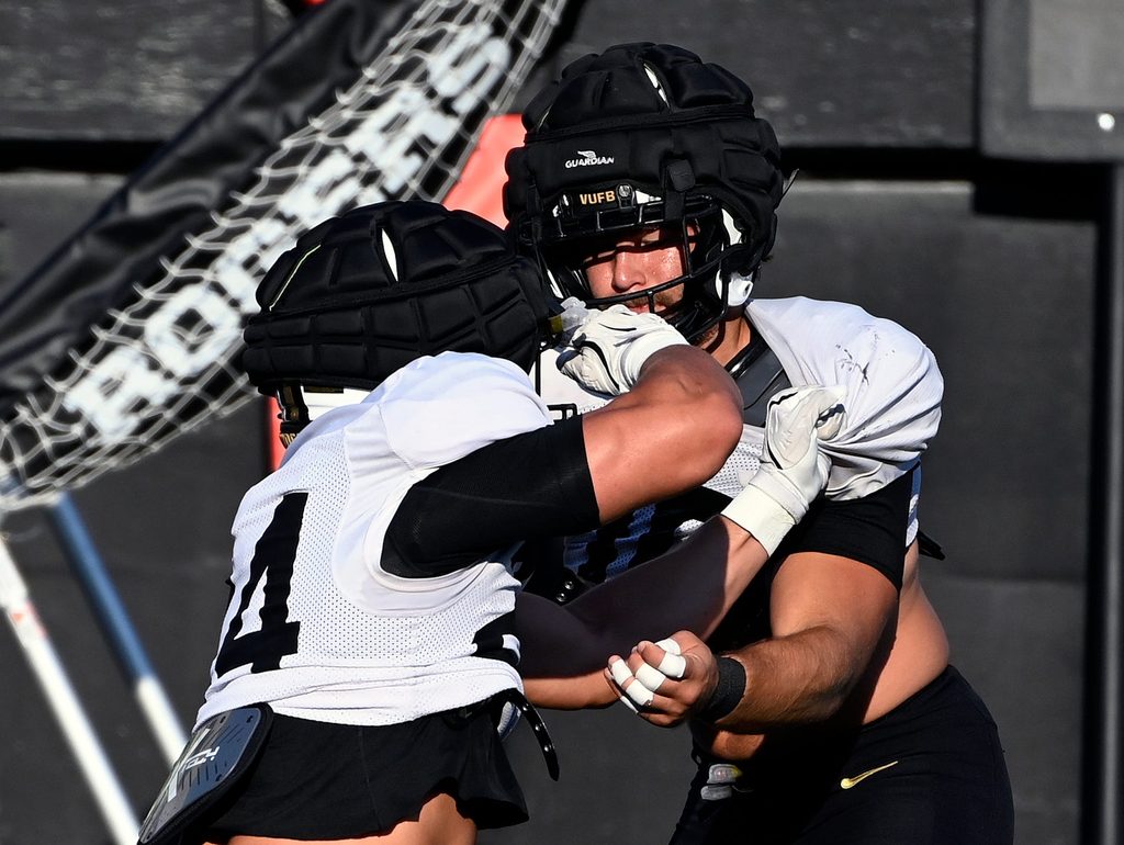 Vanderbilt linebacker Langston Patterson, right, runs through a blocking drill with Nicholas Rinaldi (24) before an NCAA college football scrimmage Saturday, Aug. 10, 2024, in Nashville, Tenn.
