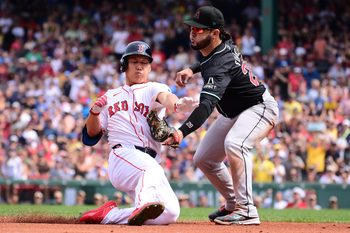 Aug 25, 2024; Boston, Massachusetts, USA; Boston Red Sox designated hitter Masataka Yoshida (7) is tagged out by Arizona Diamondbacks third baseman Eugenio Suarez (28) during the fourth inning at Fenway Park. Mandatory Credit: Eric Canha-Imagn Images