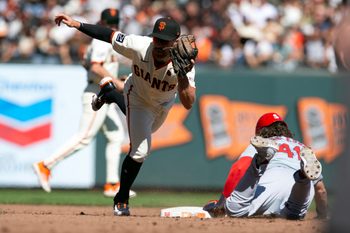 Sep 29, 2024; San Francisco, California, USA; San Francisco Giants second baseman Donovan Walton (18) tags out St. Louis Cardinals center fielder Alec Burleson (41) on an attempted steal during the sixth inning at Oracle Park. Mandatory Credit: D. Ross Cameron-Imagn Images