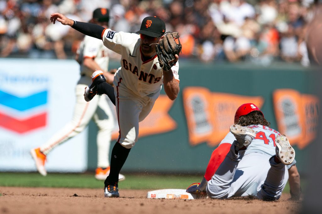 Sep 29, 2024; San Francisco, California, USA; San Francisco Giants second baseman Donovan Walton (18) tags out St. Louis Cardinals center fielder Alec Burleson (41) on an attempted steal during the sixth inning at Oracle Park. Mandatory Credit: D. Ross Cameron-Imagn Images