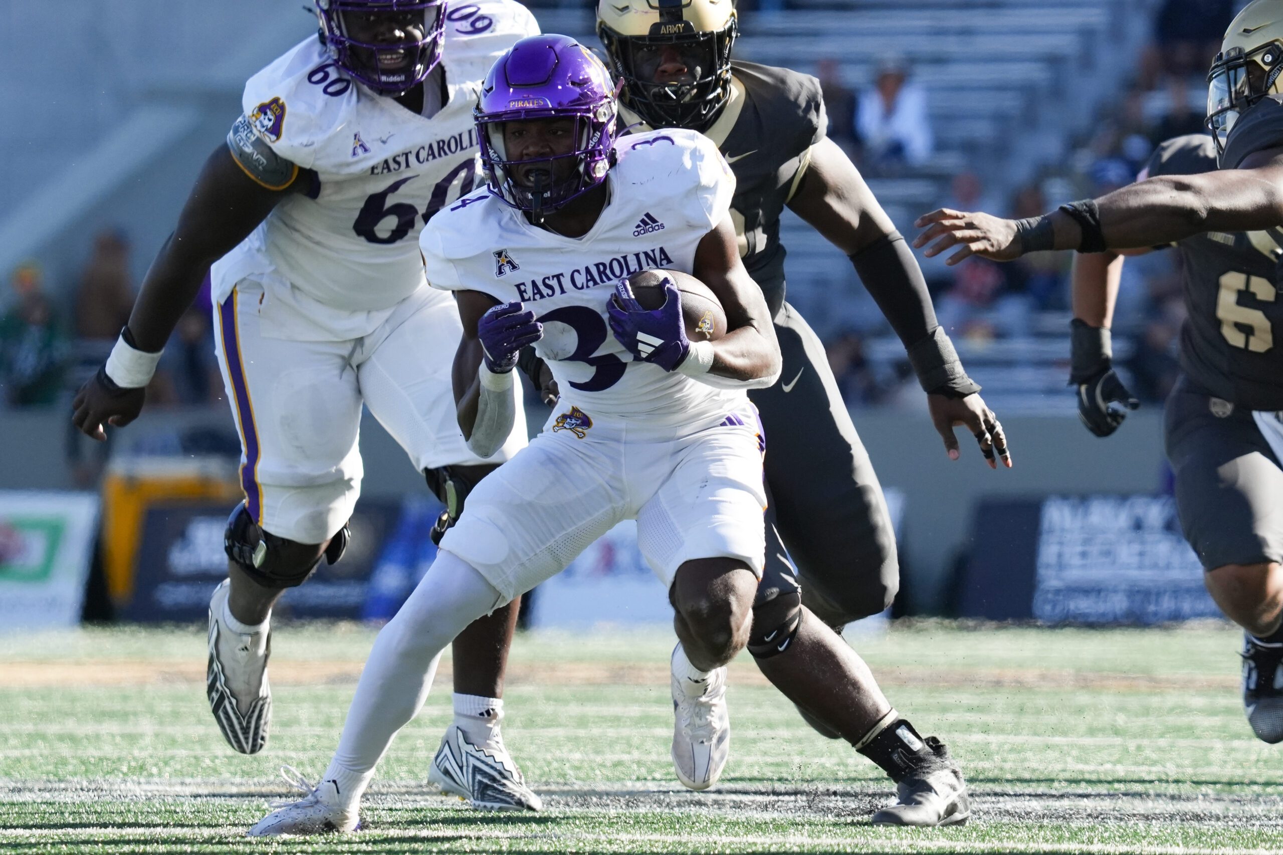 Oct 19, 2024; West Point, New York, USA; East Carolina Pirates running back London Montgomery (34) carries during the second half against the Army Black Knights at Michie Stadium. Mandatory Credit: Lucas Boland-Imagn Images