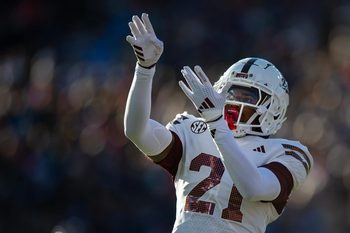 Mississippi State's running back Davon Booth (21) celebrates a touchdown during the Egg Bowl game against Mississippi at Vaught-Hemingway Stadium on Friday, Nov. 29, 2024.