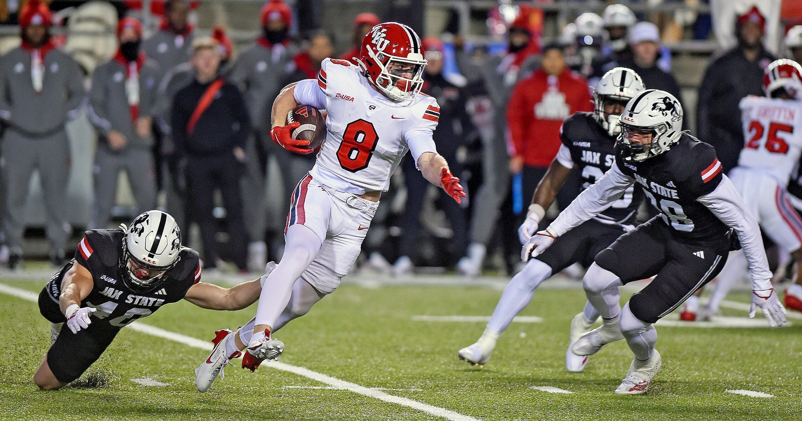 Western Kentucky's Easton Messer tries to evade the tackle of Jacksonville State's Walker O'Steen during the C-USA Championship at AmFirst Stadium in Jacksonville, Alabama , Alabama December 6, 2024. (Dave Hyatt / Hyatt Media LLC)