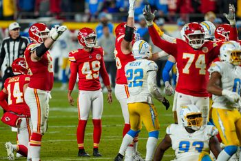 Dec 8, 2024; Kansas City, Missouri, USA; Kansas City Chiefs place kicker Matthew Wright (49) watches a game winning field goal as time expires against the Los Angeles Chargers at GEHA Field at Arrowhead Stadium. Mandatory Credit: Jay Biggerstaff-Imagn Images