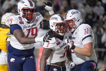 Salute to Veterans Bowl (Dec. 14): South Alabama running back Kentrel Bullock (3) is congratulated on his touchdown run by teammates during the Salute to Veterans Bowl held at Cramton Bowl in Montgomery, Alabama. South Alabama won the game, 30-23.