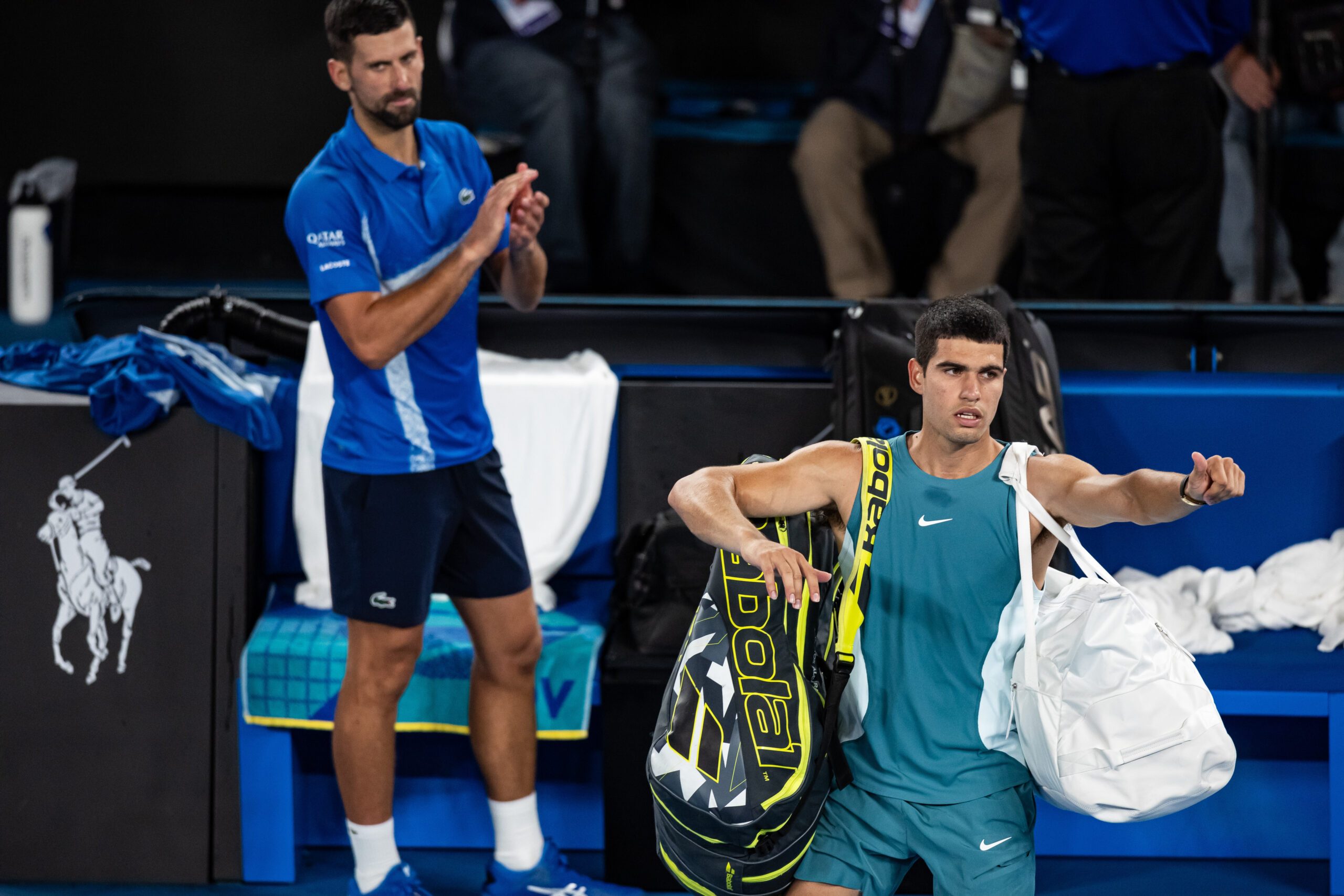 Jan 22, 2025; Melbourne, Victoria, Australia; Carlos Alcaraz of Spain gestures during his match against Novak Djokovic of Serbia in the quarterfinals of the men's singles at the 2025 Australian Open at Melbourne Park. Mandatory Credit: Mike Frey-Imagn Images