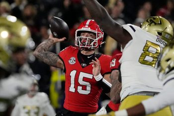 Georgia quarterback Carson Beck (15) throws the ball during the first half of a NCAA college football game against Georgia Tech in Athens, Ga., on Friday, Nov. 29, 2024.