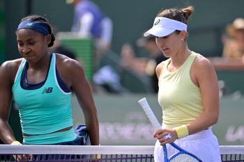 Mar 12, 2025; Indian Wells, CA, USA;  Coco Gauff (USA) and Belinda Bencic (SUI) leave the court following the fourth round of the BNP Paribas Open at the Indian Well Tennis Garden. Mandatory Credit: Jayne Kamin-Oncea-Imagn Images