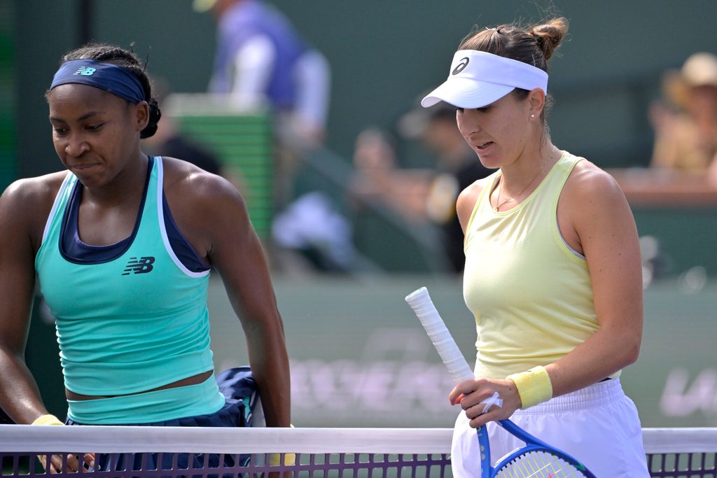 Mar 12, 2025; Indian Wells, CA, USA;  Coco Gauff (USA) and Belinda Bencic (SUI) leave the court following the fourth round of the BNP Paribas Open at the Indian Well Tennis Garden. Mandatory Credit: Jayne Kamin-Oncea-Imagn Images
