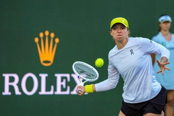 Iga Swiatek hits to Mirra Andreeva during the WTA semifinals at the BNP Paribas Open in Indian Wells, Calif., Friday, March 14, 2025.