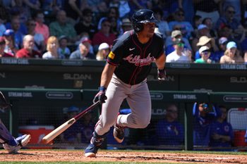 Mar 24, 2025; Mesa, Arizona, USA; Atlanta Braves catcher Drake Baldwin (75) hits an RBI single against the Chicago Cubs in the second inning at Sloan Park. Mandatory Credit: Rick Scuteri-Imagn Images