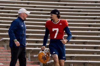 UTEP sophomore quarterback Malachi Nelson (7) and head coach Scotty Walden talk as they walk down from the Mine Shaft to the field for spring practice at the Sun Bowl in El Paso, Texas, on Friday, April 4, 2025.